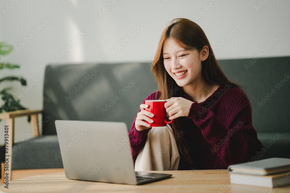 Smiling young woman uses social media to relax at home on the weekend. Relaxation concept Smiling young woman uses social media to relax at home on the weekend. Relaxation concept