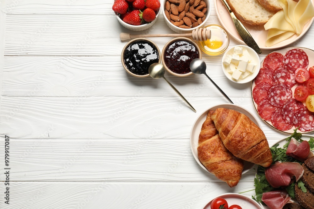 Different tasty food served for brunch on white wooden table, flat lay. Space for text Different tasty food served for brunch on white wooden table, flat lay. Space for text