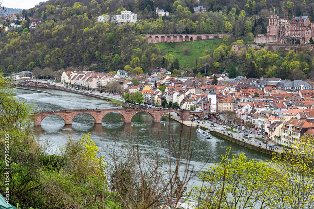Fototapeta premium Heidelberg, Germany - 31.03.2024 - View of the Karl Theodor Bridge, The Old Bridge and the Heidelberg Castle from Philosophers' Walk in Heidelberg, Easter 2024