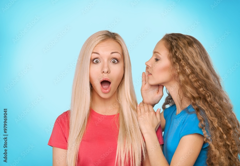Handsome young friends sharing secret or gossip Handsome young friends sharing secret or gossip