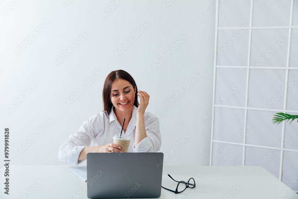 Business woman brunette smiling at work in office with laptop Business woman brunette smiling at work in office with laptop