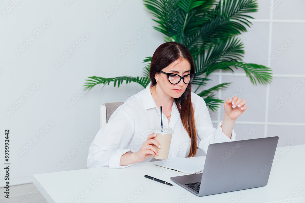 woman brunette working training with laptop online at desk woman brunette working training with laptop online at desk