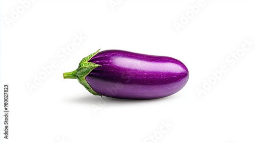  Eggplant with purple hue against white backdrop and green stalk attached to its end