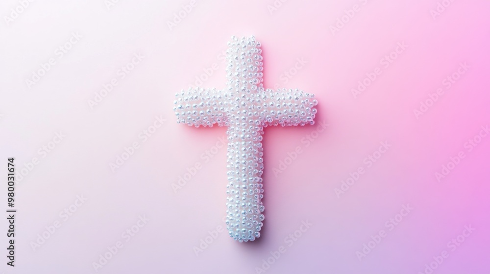 Obraz premium Cross Made of White Beads on a Pink Background. 