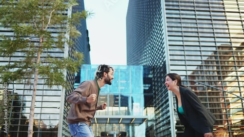 Excited businesspeople celebrating completion of successful project. Cheerful entrepreneurs high fiving and congratulating each other after closing lucrative business deal 