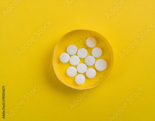 close-up of white medicine placed on bright yellow background. generative ai photo