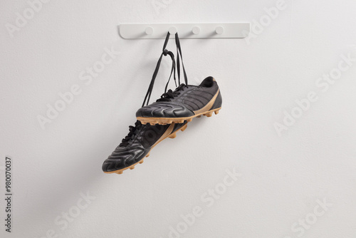 Black football cleats hanging photo