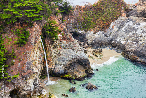 Beautiful landscape of Pacific Ocean coast along Highway 1 and Big Sur, McWay Falls view from aerial, sunset, sunrise, fog. Concept, travel, vacation, weekend photo