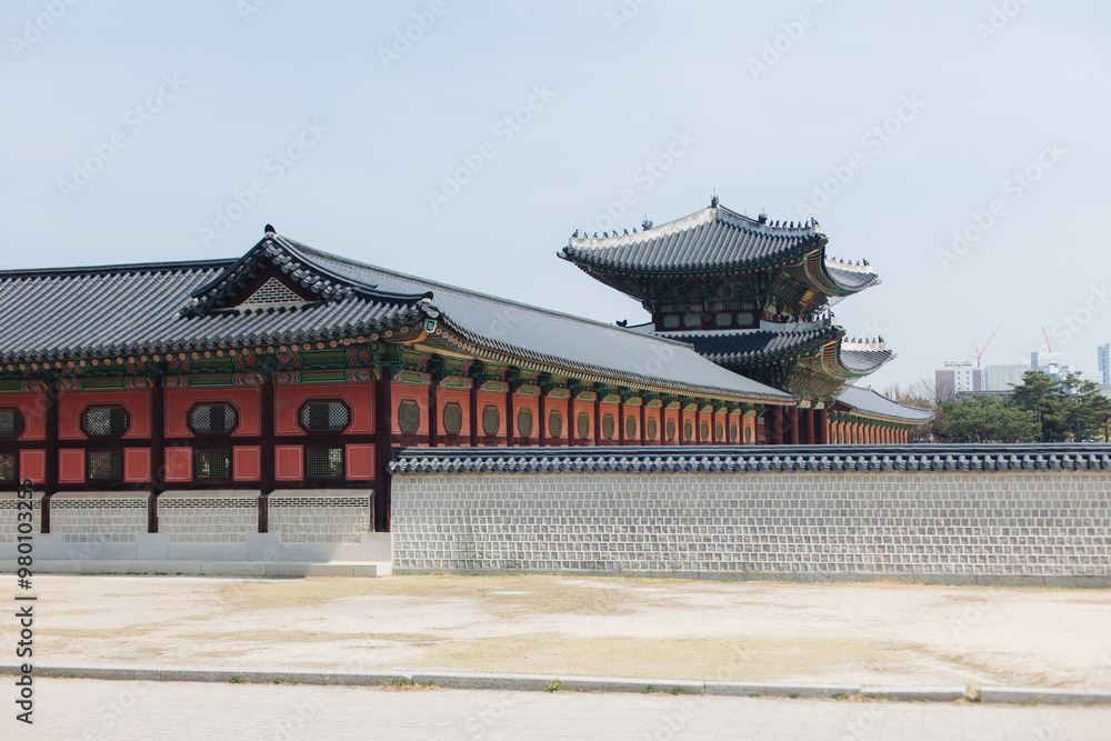 Gyeongbokgung Palace, Seoul, Jongno District, South Korea, in a spring sunny day, exterior view of main Korean royal palace in Cherry Blossom season, with Bugaksan mountain in the background Gyeongbokgung Palace, Seoul, Jongno District, South Korea, in a spring sunny day, exterior view of main Korean royal palace in Cherry Blossom season, with Bugaksan mountain in the background