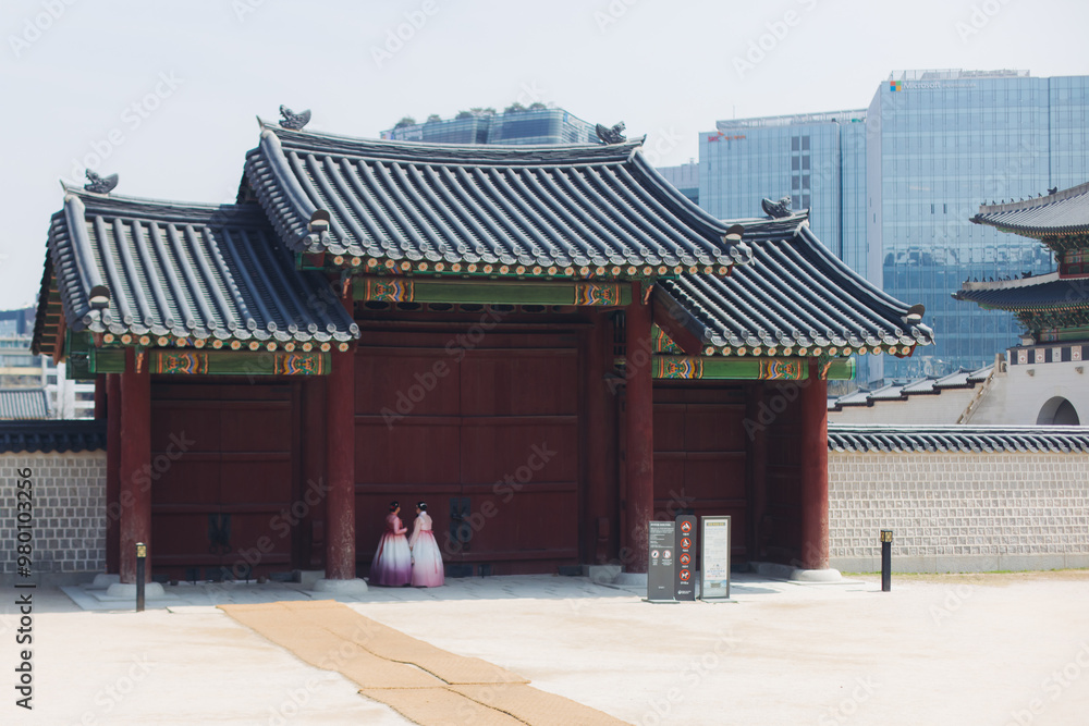 Gyeongbokgung Palace, Seoul, Jongno District, South Korea, in a spring sunny day, exterior view of main Korean royal palace in Cherry Blossom season, with Bugaksan mountain in the background Gyeongbokgung Palace, Seoul, Jongno District, South Korea, in a spring sunny day, exterior view of main Korean royal palace in Cherry Blossom season, with Bugaksan mountain in the background