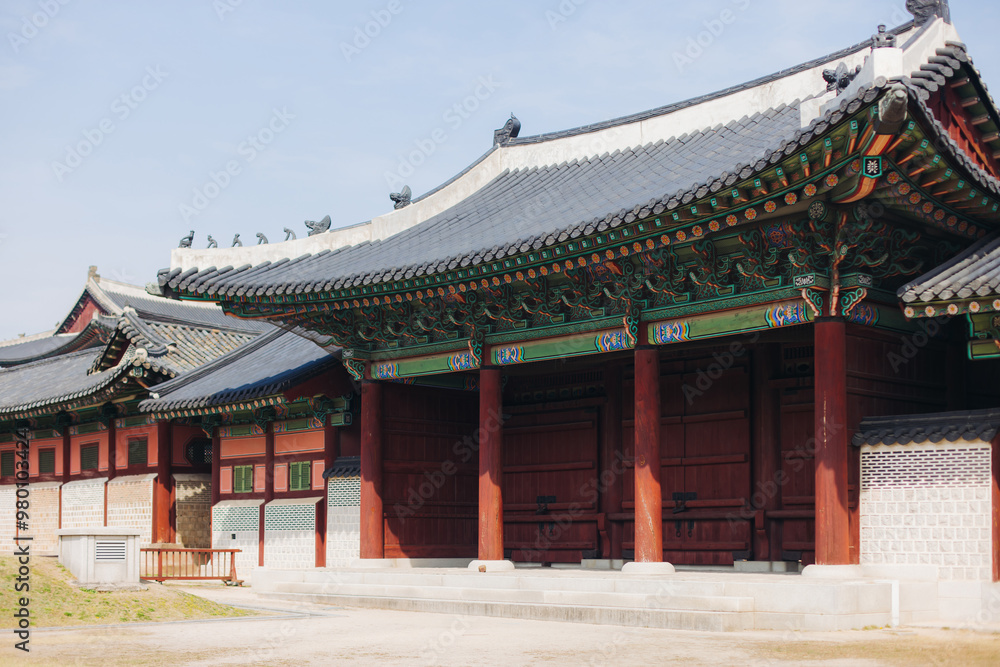 Gyeongbokgung Palace, Seoul, Jongno District, South Korea, in a spring sunny day, exterior view of main Korean royal palace in Cherry Blossom season, with Bugaksan mountain in the background Gyeongbokgung Palace, Seoul, Jongno District, South Korea, in a spring sunny day, exterior view of main Korean royal palace in Cherry Blossom season, with Bugaksan mountain in the background