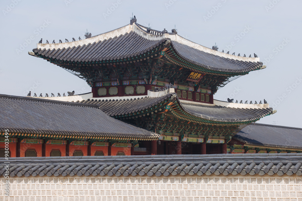 Gyeongbokgung Palace, Seoul, Jongno District, South Korea, in a spring sunny day, exterior view of main Korean royal palace in Cherry Blossom season, with Bugaksan mountain in the background Gyeongbokgung Palace, Seoul, Jongno District, South Korea, in a spring sunny day, exterior view of main Korean royal palace in Cherry Blossom season, with Bugaksan mountain in the background