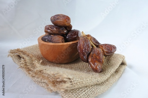 Dates in a wooden bowl