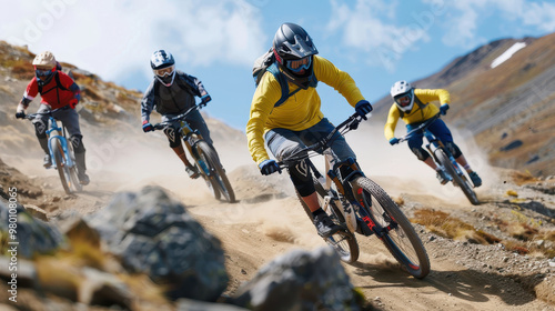 Group of mountain bikers speeding down a rugged trail  symbolizing adventure  endurance  and the thrill of outdoor cycling sports.