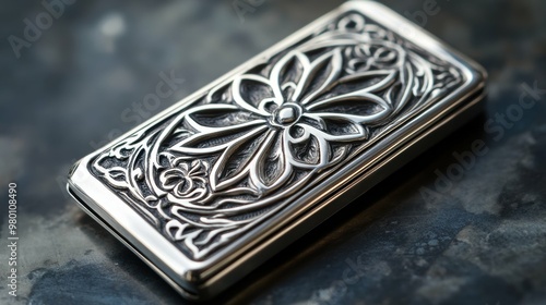 Refined silver-plated money clip engraved with an intricate geometric pattern with free copy space photo