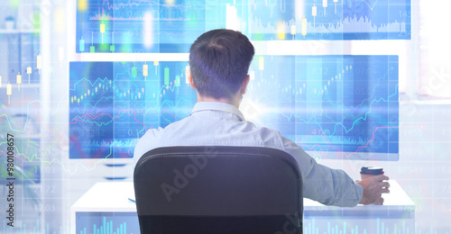 Male trader working at tabl...