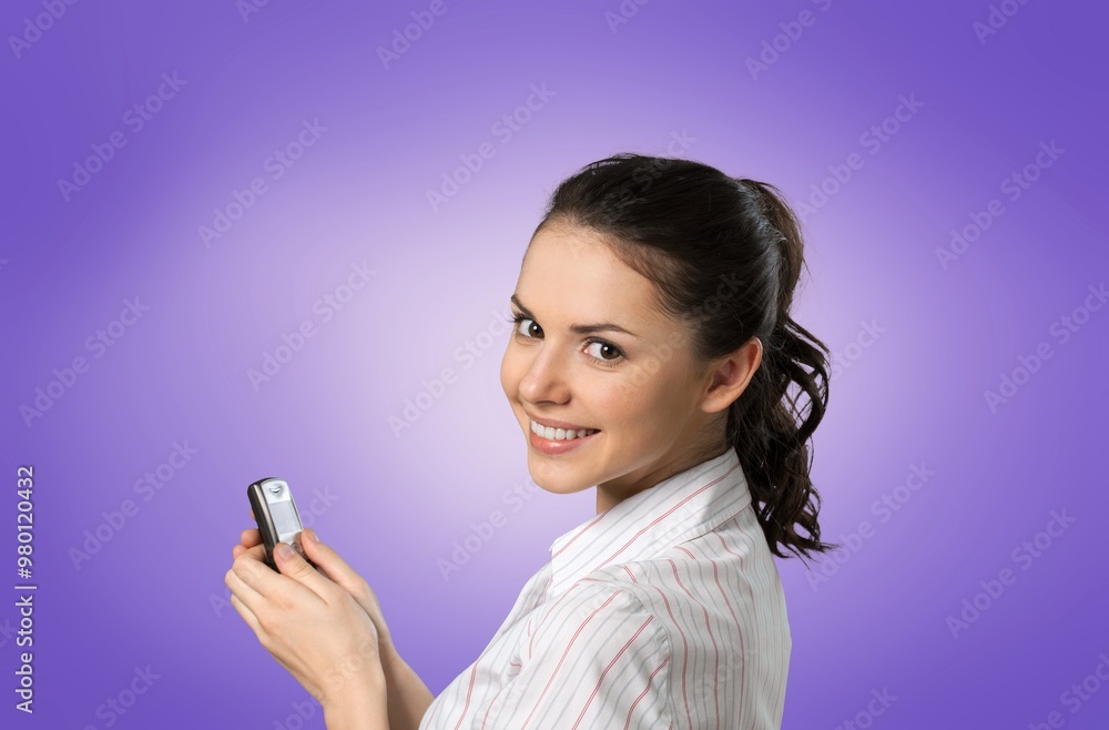 Happy pretty young woman holding smartphone Happy pretty young woman holding smartphone