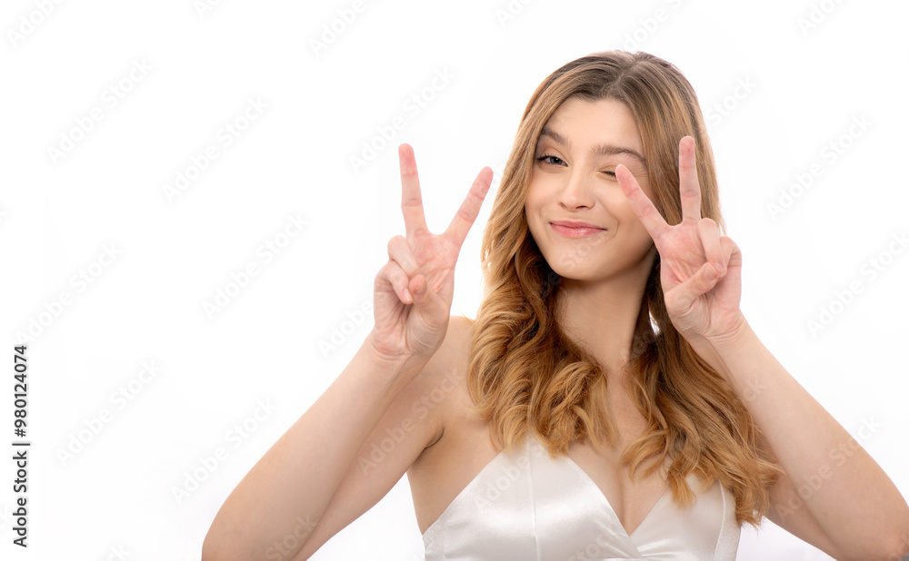 Beautiful young happy smiling woman with long blond wavy flowing hair showing gestures. Model with professional make up and curly hairdo. Isolated on white. Beautiful young happy smiling woman with long blond wavy flowing hair showing gestures. Model with professional make up and curly hairdo. Isolated on white.