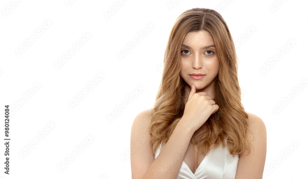 Beautiful young woman with long blond wavy flowing hair. Model with professional make up and curly hairdo. Spa and wellness. Haircare, shampoo and lotion. Isolated on white Beautiful young woman with long blond wavy flowing hair. Model with professional make up and curly hairdo. Spa and wellness. Haircare, shampoo and lotion. Isolated on white