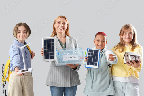 Pupils and teacher with env...