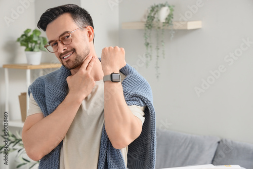Young man with smartwatch c...