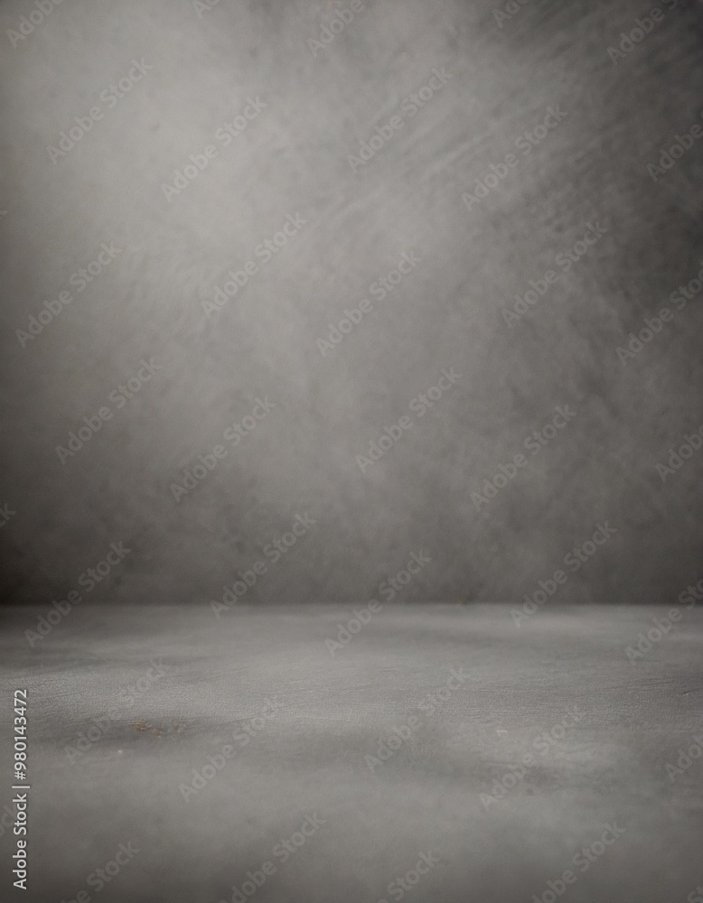 Textured gray photography studio background with depth of field for a dramatic effect Textured gray photography studio background with depth of field for a dramatic effect
