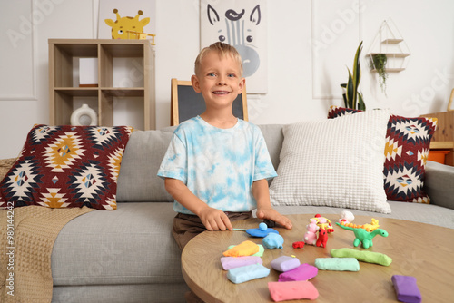 Cute little boy on sofa scu...