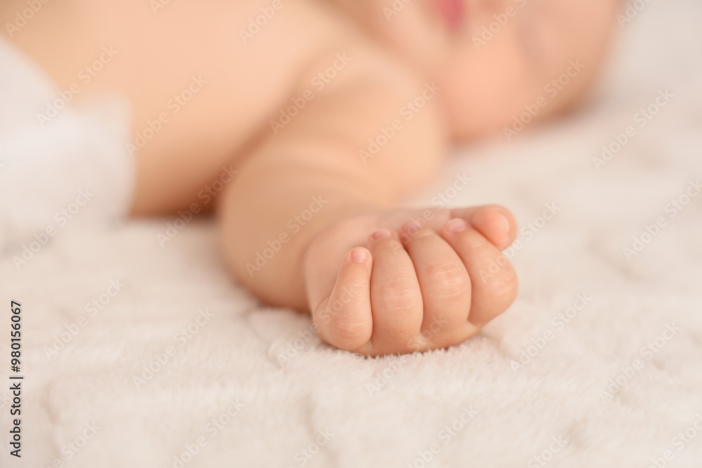 Cute little baby lying on bed, closeup Cute little baby lying on bed, closeup