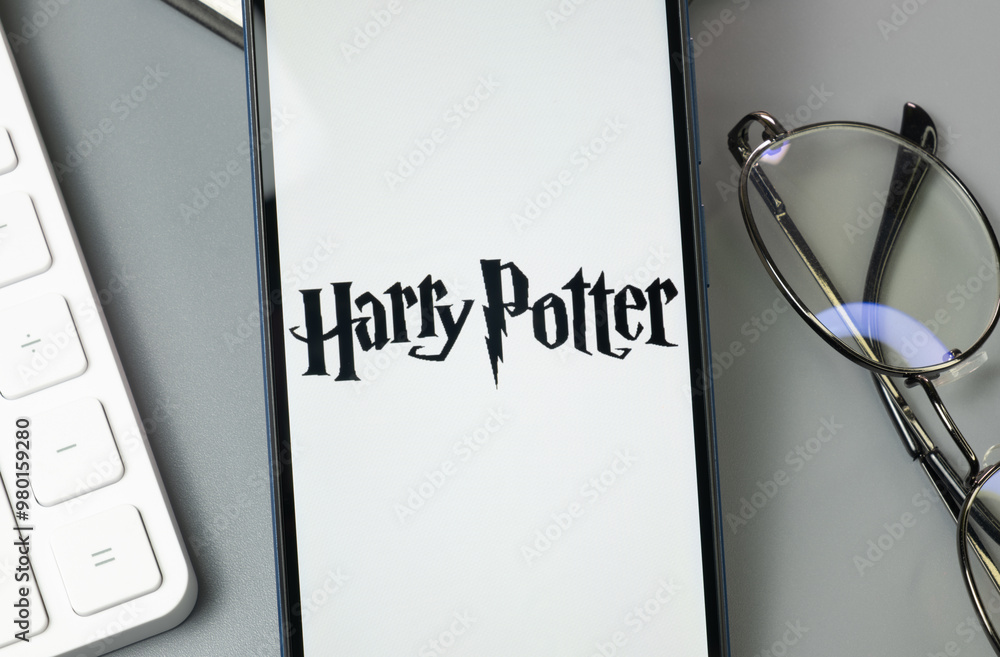 Fototapeta premium New York, USA - 30 August 2024: Harry Potter Logo on Phone Screen, Company Icon on Display