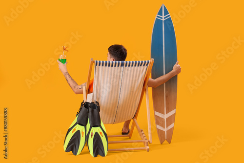 Young man with cocktail and...