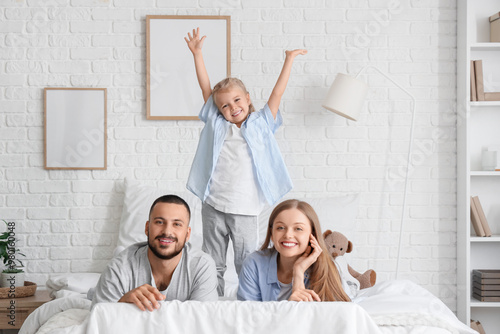 Happy Family Playing on Bed...