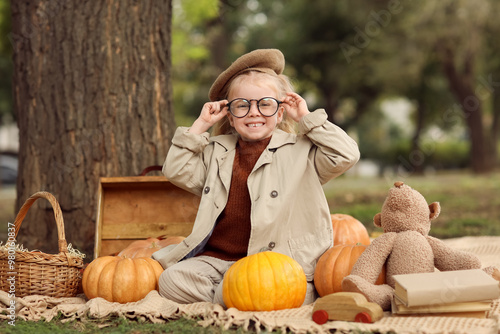 Cute little girl with pumpk...
