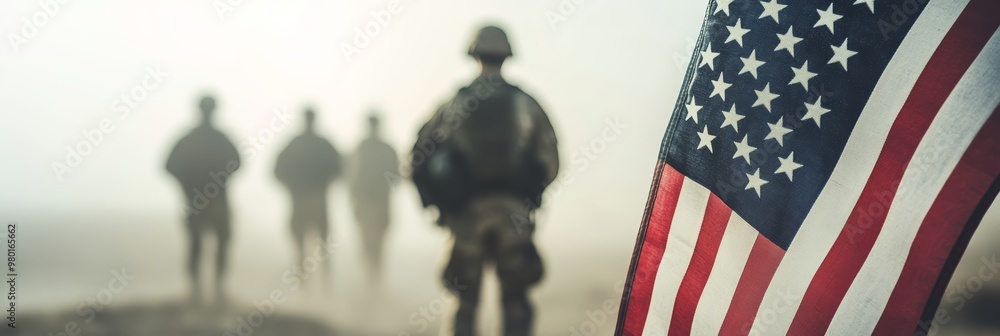 Silhouette of soldiers with the American flag in mist, embodying the spirit of Veterans Day. Silhouette of soldiers with the American flag in mist, embodying the spirit of Veterans Day.