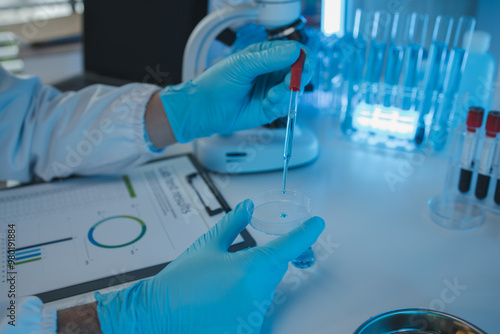 a researcher is conducting scientific experiments on a liquid substance, a scientist is using laboratory equipment to analyze a liquid sample, chemicals are tested in a lab