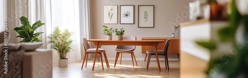 A cozy dining area with plants and framed artwork, promoting relaxation and comfort.