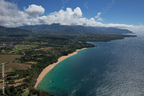 A beautiful aerial view of a sandy beach along a tropical coastline, perfect for travel, nature, and outdoor adventure projects, as well as editorial or tourism-related content.