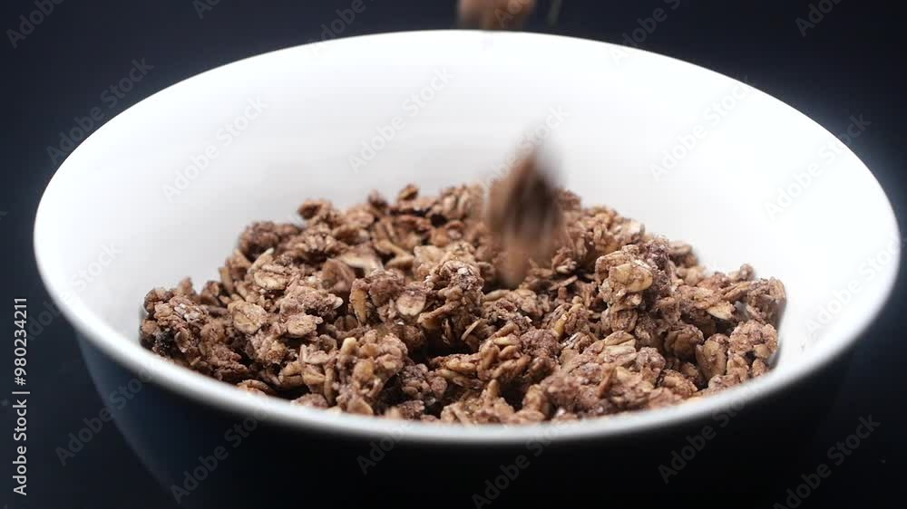 Indulge in a bowl of Delicious Chocolate Granola that is both tasty and satisfying Indulge in a bowl of Delicious Chocolate Granola that is both tasty and satisfying