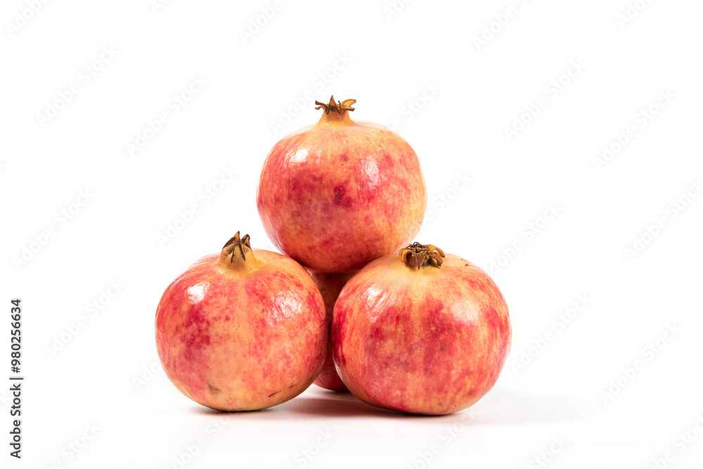 whole pomegranates isolated on white background. whole pomegranates isolated on white background.