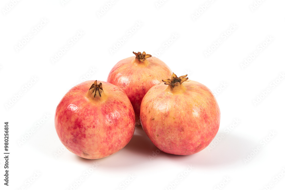 whole pomegranates isolated on white background. whole pomegranates isolated on white background.