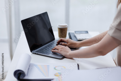 Businesswoman working at office with documents on his desk, doing planning analyzing the financial report, business plan investment, finance analysis concept 