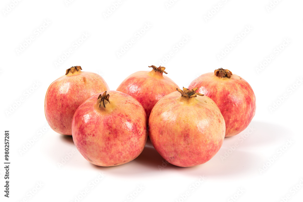 whole pomegranates isolated on white background. whole pomegranates isolated on white background.