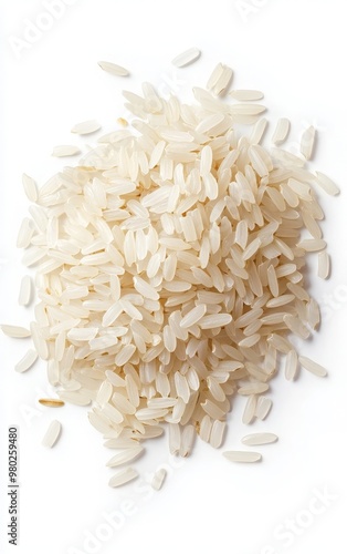 A close-up of uncooked white rice grains piled on a surface, showcasing its texture and natural beauty.