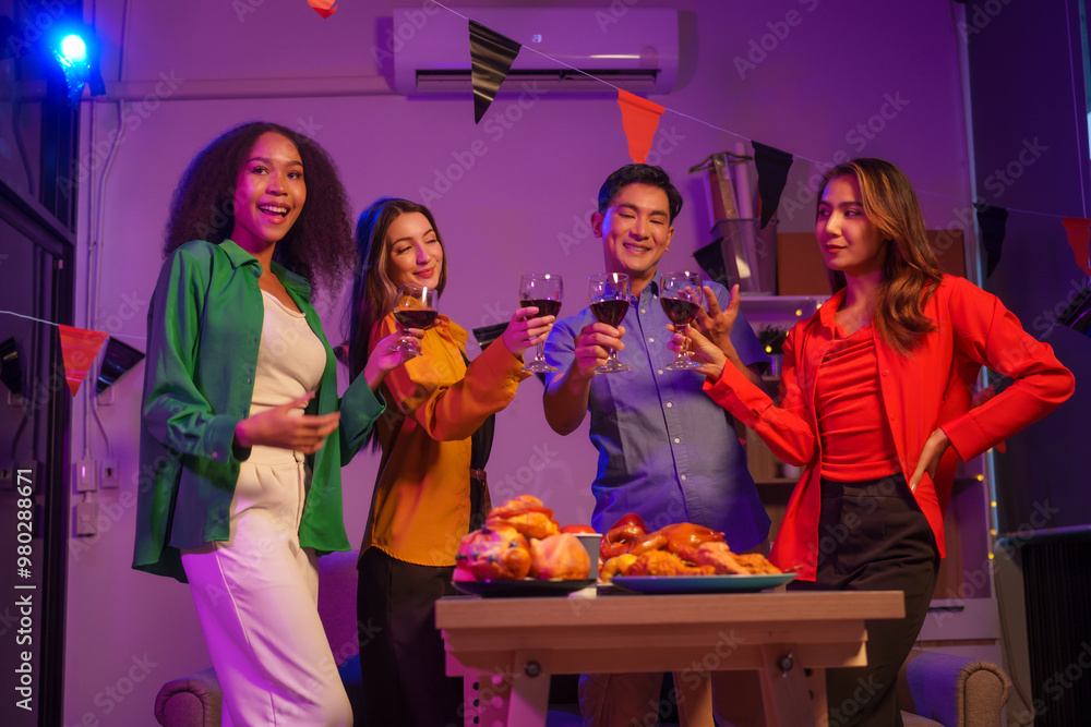 An African American woman and a white woman celebrate with coworkers, drinking, having fun, and smiling together at a lively Halloween night party filled with joy and laughter. An African American woman and a white woman celebrate with coworkers, drinking, having fun, and smiling together at a lively Halloween night party filled with joy and laughter.