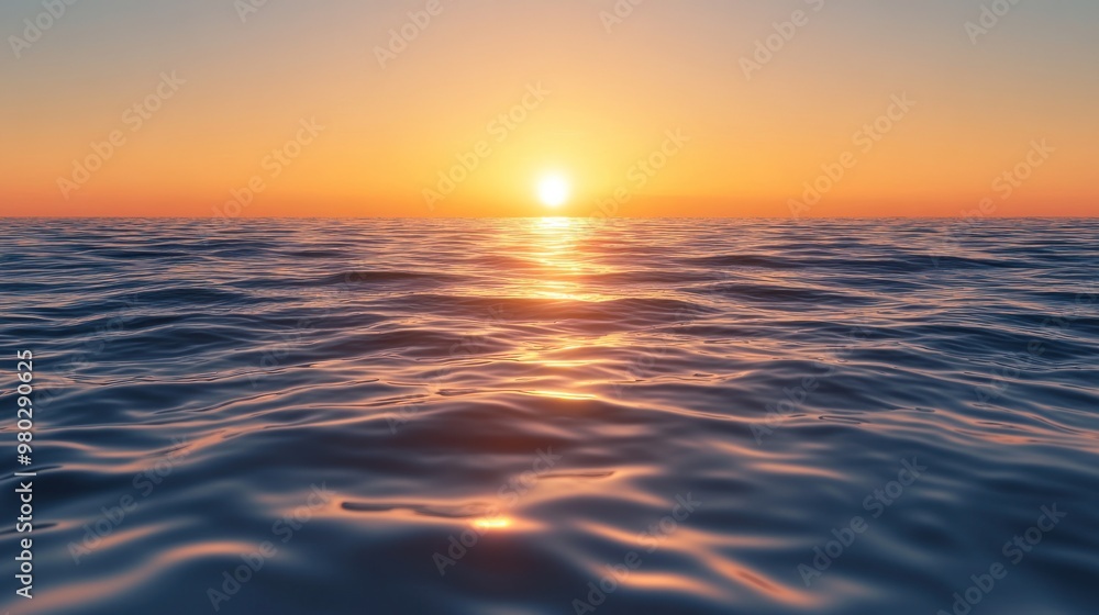 Obraz premium The ocean's calm mirrors the golden hue of sunset.