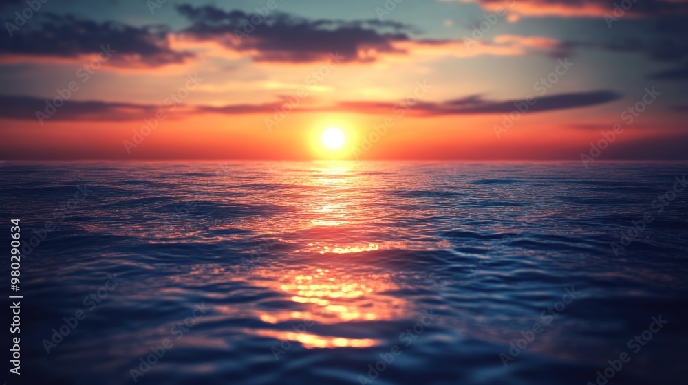 Obraz premium The ocean's calm mirrors the golden hue of sunset.