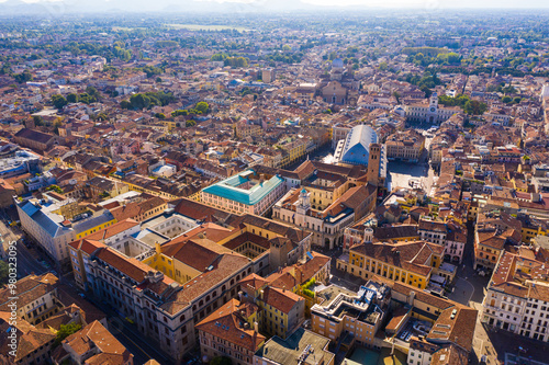 Aerial view of historical center of Italian city of Padua with blue roof of Palazzo della Ragione on sunny day