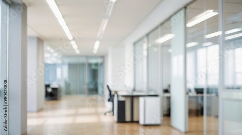 Blurred office interior meeting room with desks, chairs and monitors. Blurry working space with softly defocused effect. For background or backdrop use in business concept