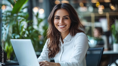 Woman in Business Attire Using Laptop