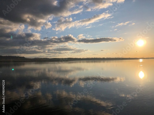 View of a sunset over the Columbia River with clouds reflecting off the water