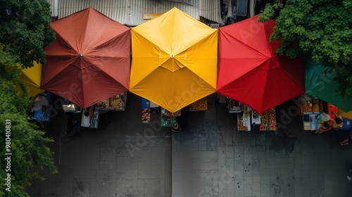 Aerial view of vibrant outdoor market with colorful tents for stock photography photo